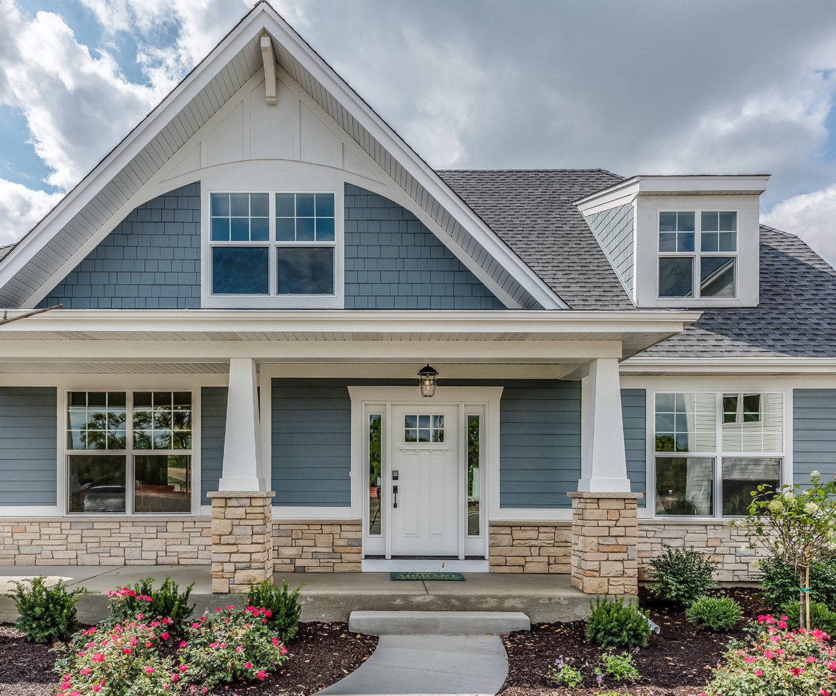 Mid-sized to smaller blue exterior home